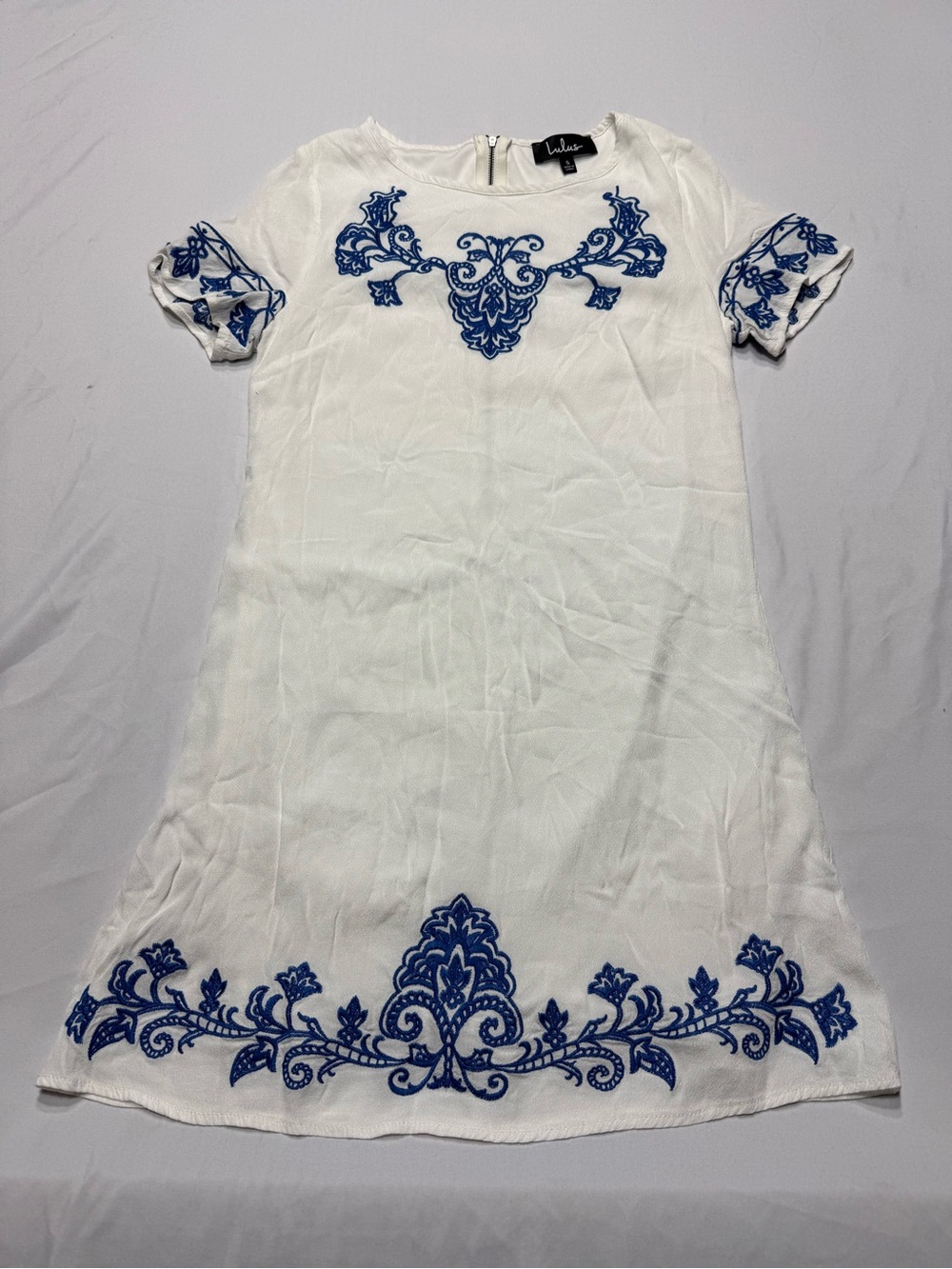 Lulu’s white dress with blue embroidery
